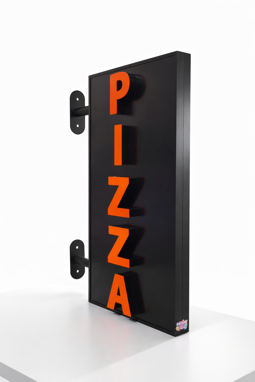 A black light sign about 1 meter high that says pizza in raised letters that glow in white.